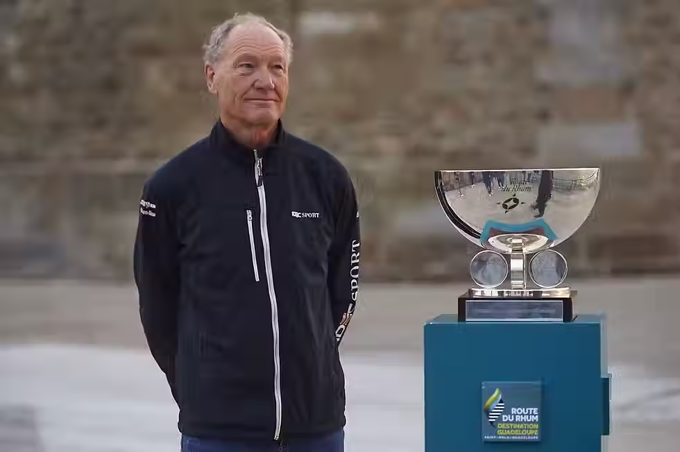 Francis Joyon next to the Route du Rhum trophy during the 2022 edition